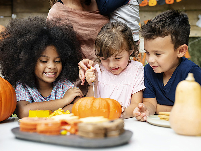 young-kids-carving-halloween-jack-o-lanterns.jpg